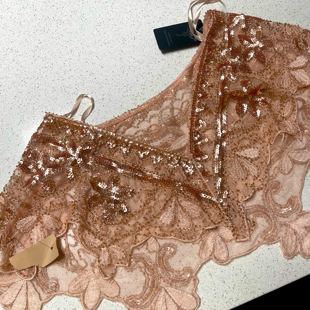Lace beaded vintage cover. Never worn. Tags still attached. So unique!